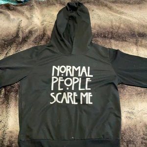 Black AHS hoodie. Text “Normal People Scare Me” size M